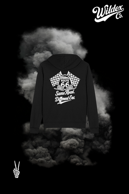 Back of the black Route 66 WILDEX CO hoodie with white Route 66 shield, checkered flags, skeleton hands and Same Road. Different Era. lettering.
