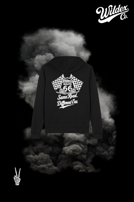 Back of the black Route 66 WILDEX CO hoodie with white Route 66 shield, checkered flags, skeleton hands and Same Road. Different Era. lettering.